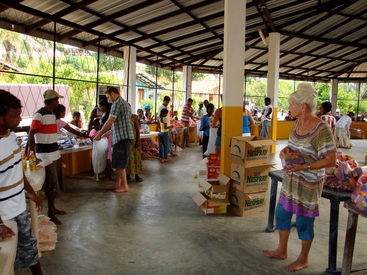 large food parcel distribution - £30 each parcel of dry products enough to last a family of 4 a month. Contents include 5 kilos of rice, dhal, noodles, tea, washing powder, toothpaste, toothbrushes, soap, dried fish, chillies, curry powder, sugar, biscuits, chilli powder, pepper powder, salt etc. There are 9 volunteers helping on this day