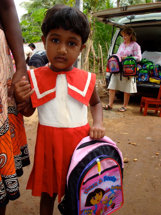 Annemarie in the background getting stuck into the school bags for the pre-schoolers! This little girl is at our 1st Pre-school