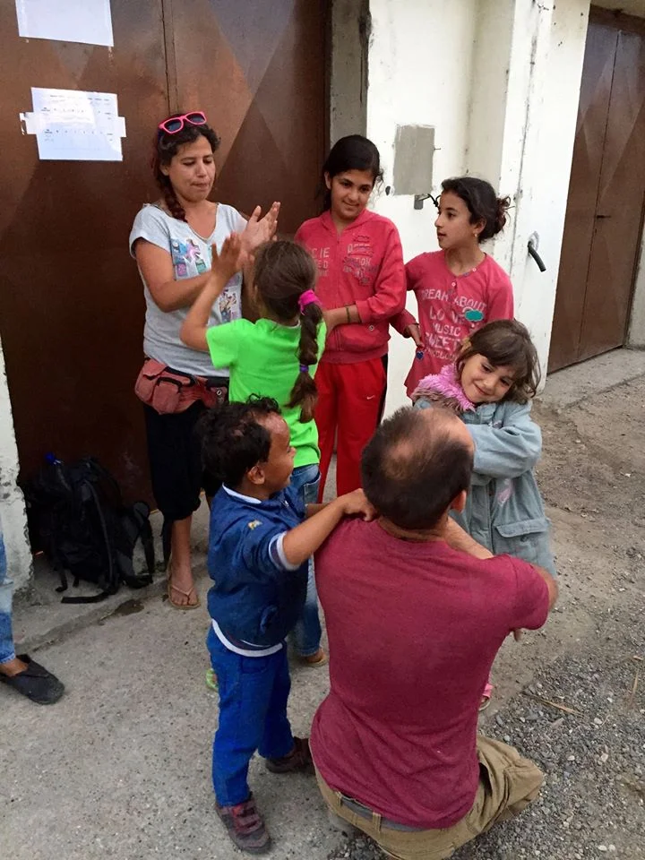 Sofia and David playing with the children