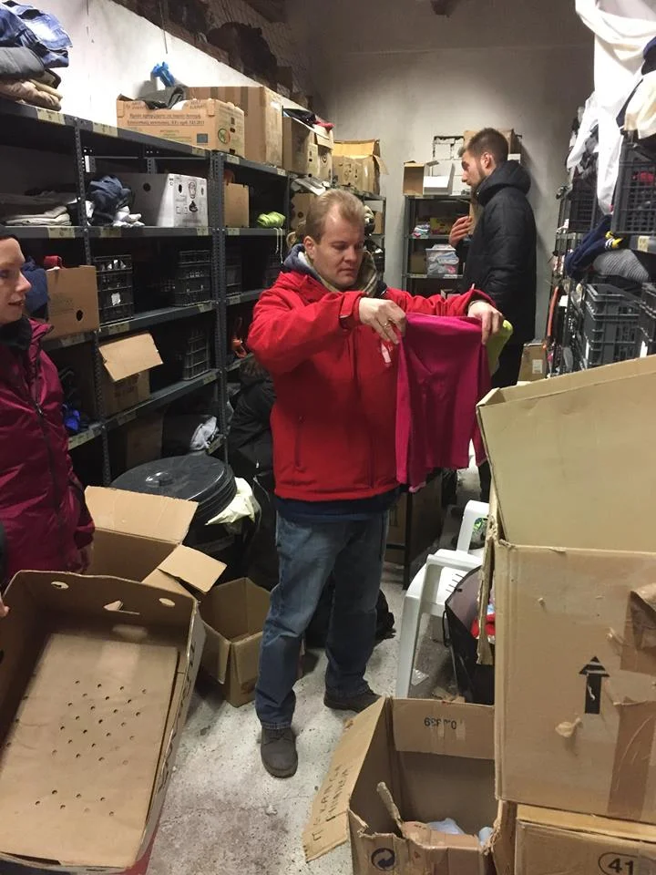 Malte from Refugees Foundation, e.V. Support for Refugees on the Run sorting clothing