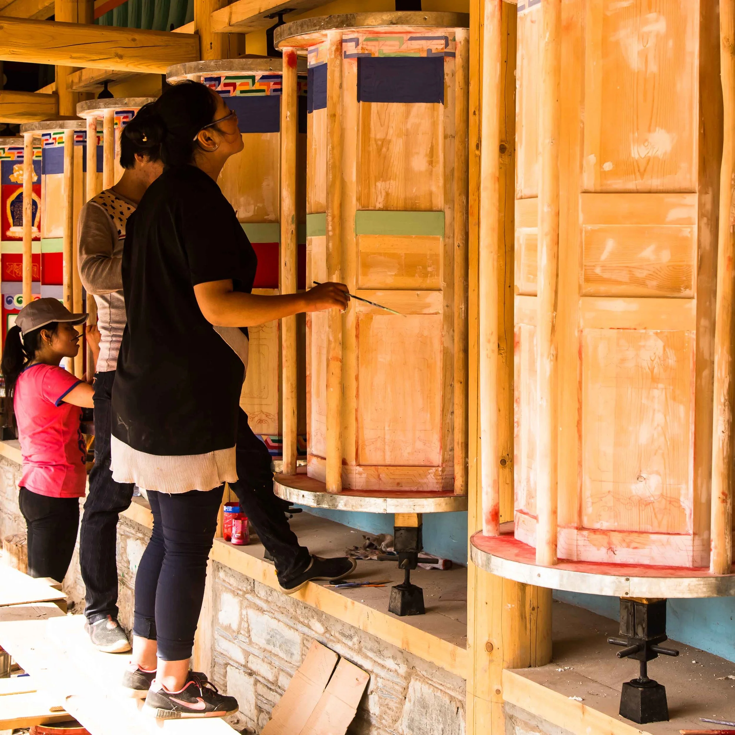 Replacing worn prayer wheels.