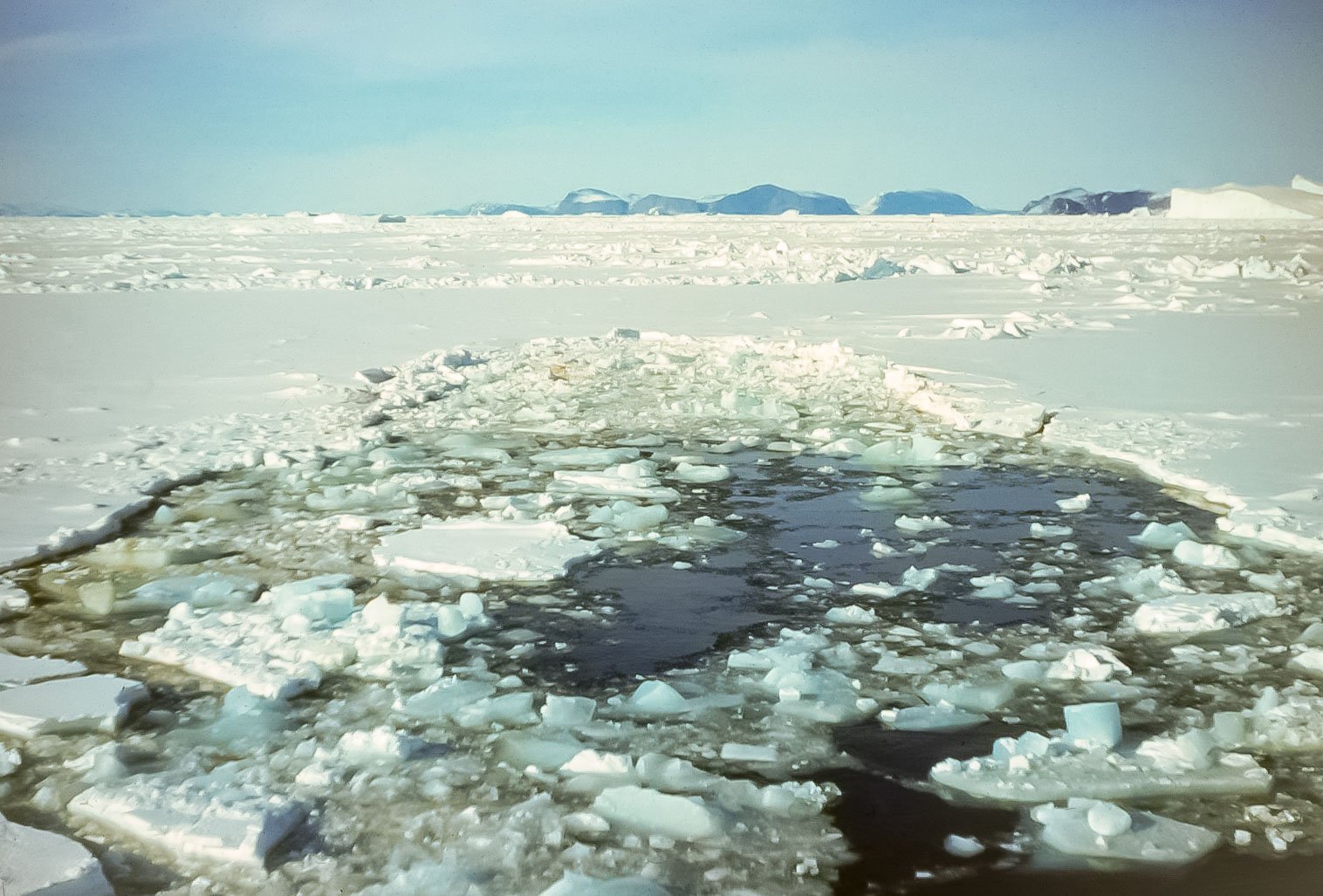 Breaking solid sea ice.