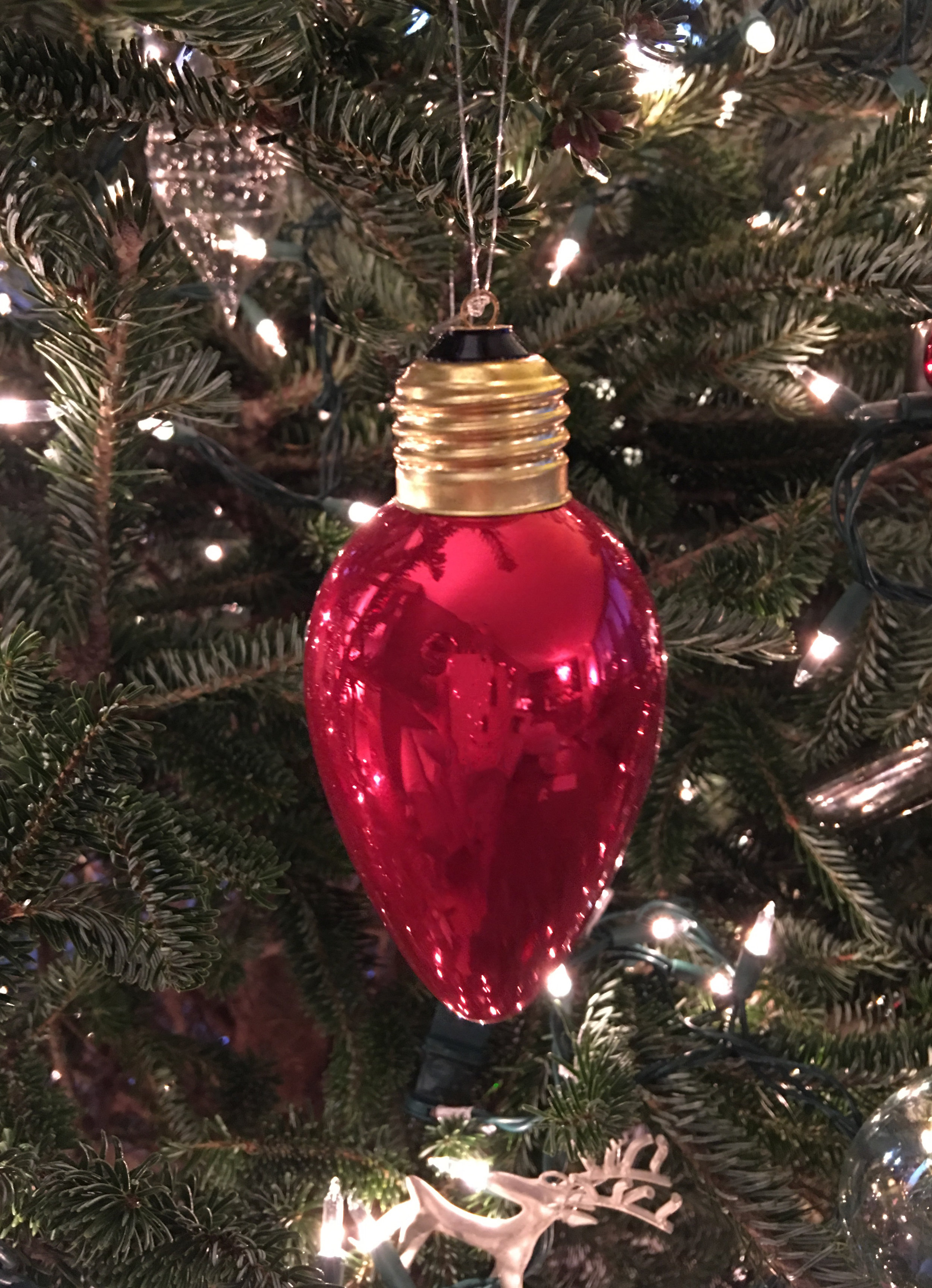 For my Christmas Tree I keep a simple palette of silver, clear glass and red ornaments like this one.