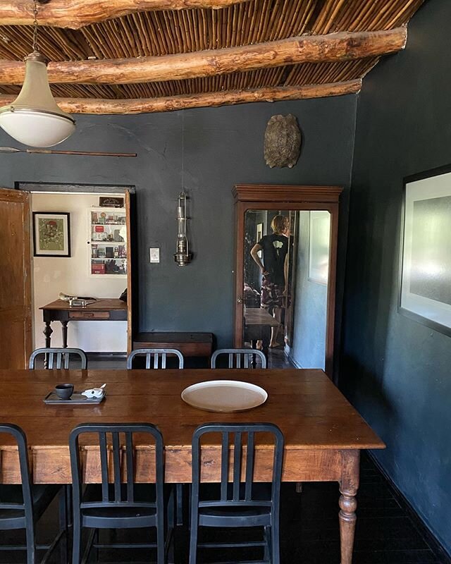 Straight out of a South African rural farm house. Love the dark blue/black walls - and the beautiful textures of the roof beams and vintage furniture. I could spend days in this home. #interiors #decor #farmhouse