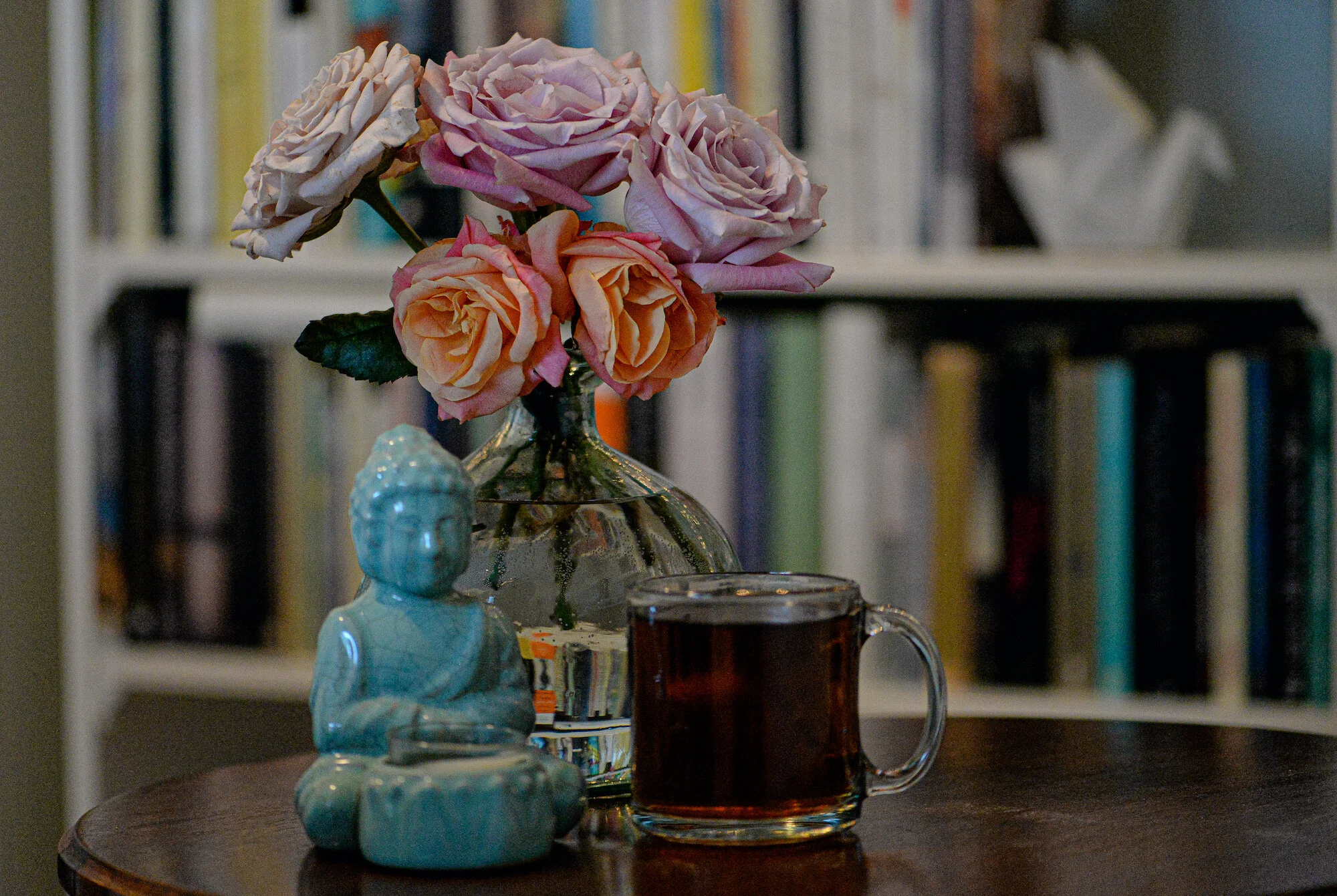 books flowers tea and buddha candle