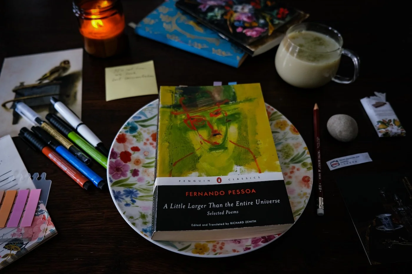 Fernando Pessoa book on a plate with books and tea