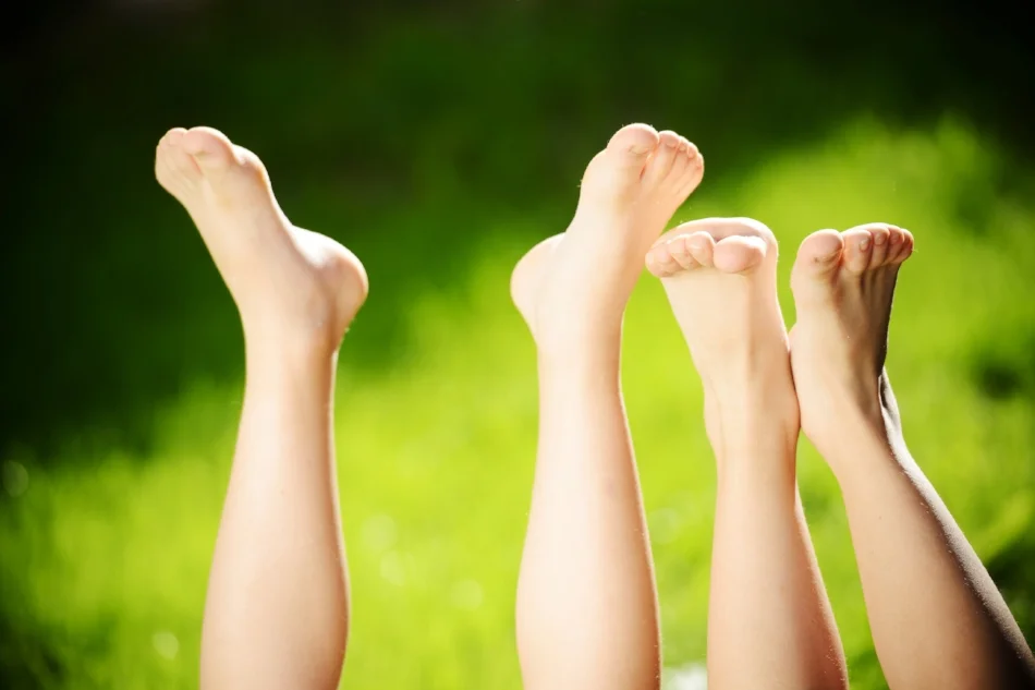 Kids with legs in air at park.jpg