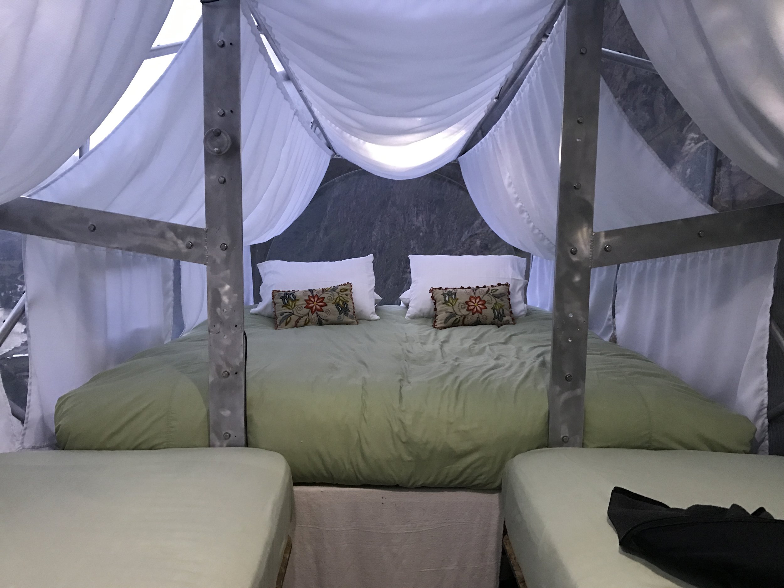 Beyond the pillows is a plexiglas window with a spectacular view of the canyon.