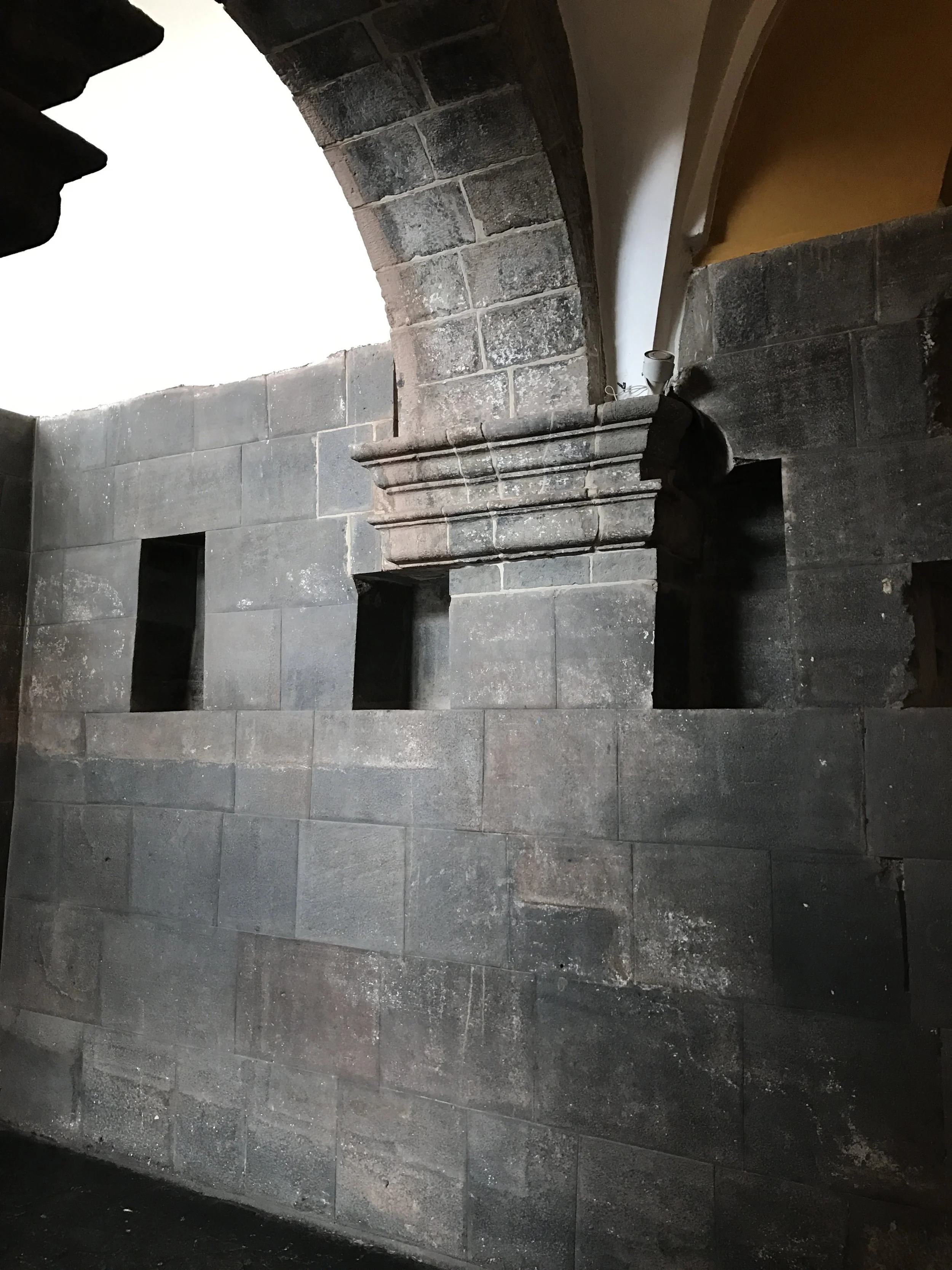 Wall of the Sun Temple serves as foundation for an arch.
