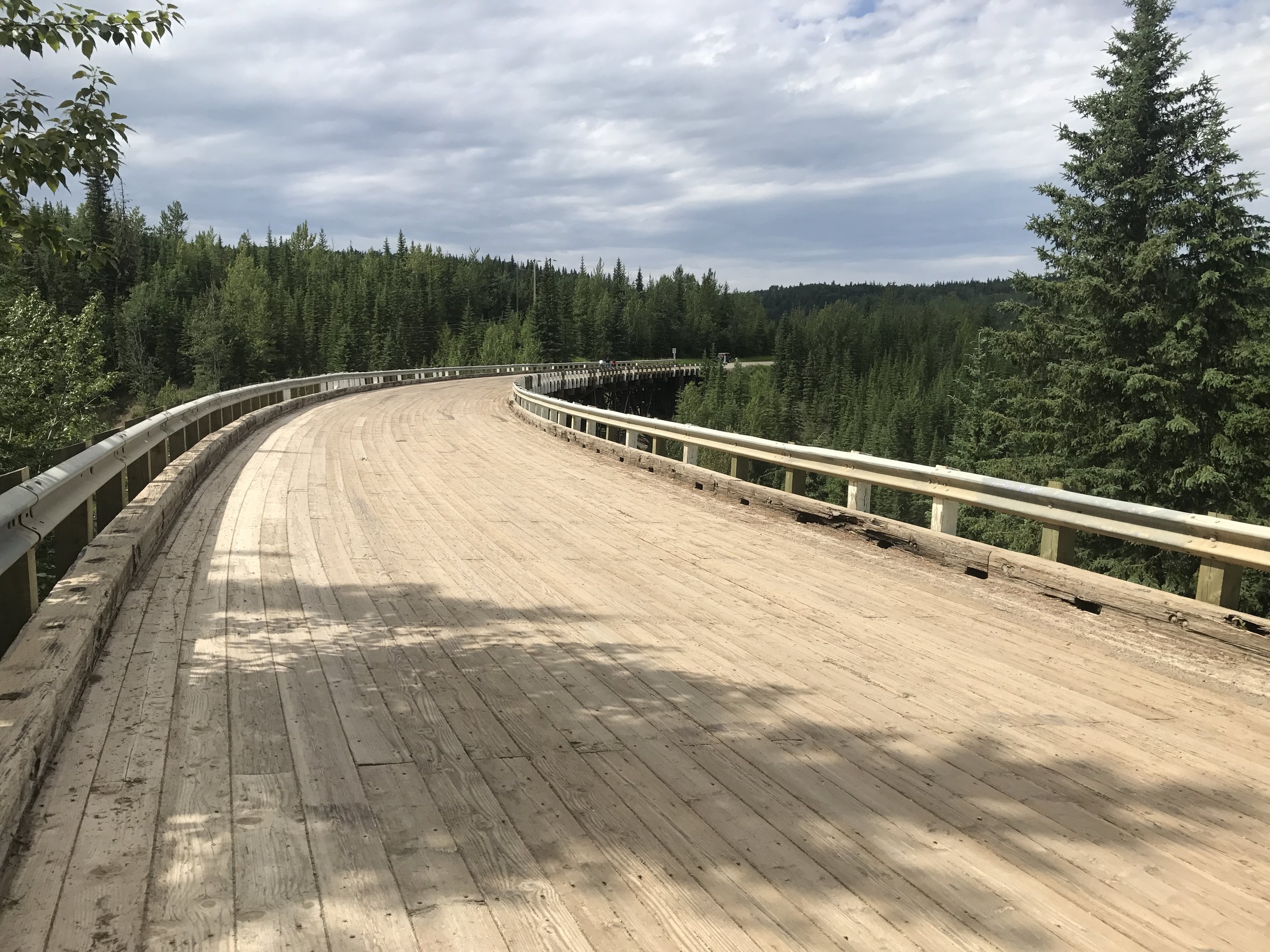 Notice the surface is made of wood and the bridge is curved. 