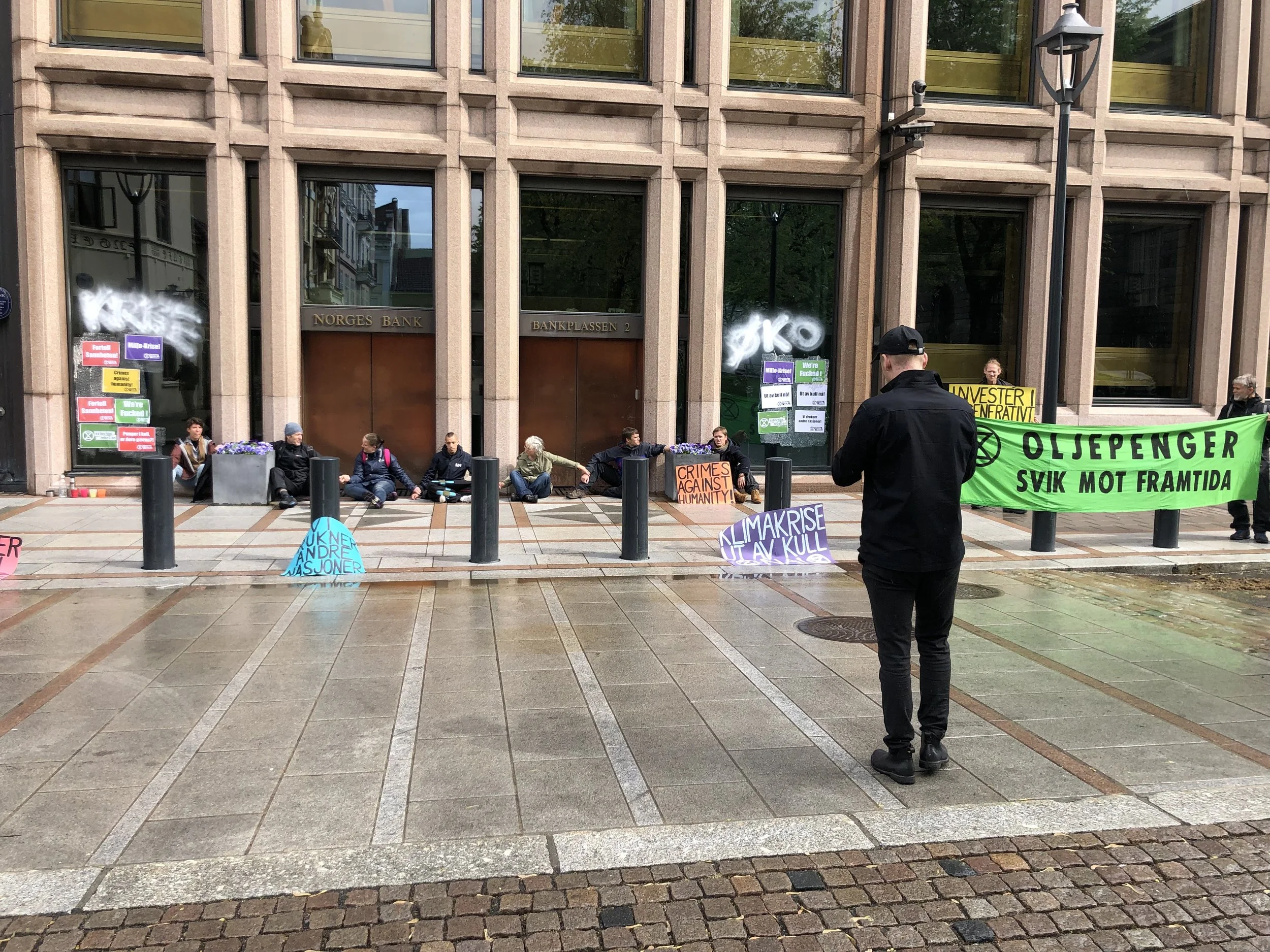 Protesting is common in Norway. These people had glued their hands together in front of a bank. They were protesting the banks practice of investing in companies that pollute the earth.