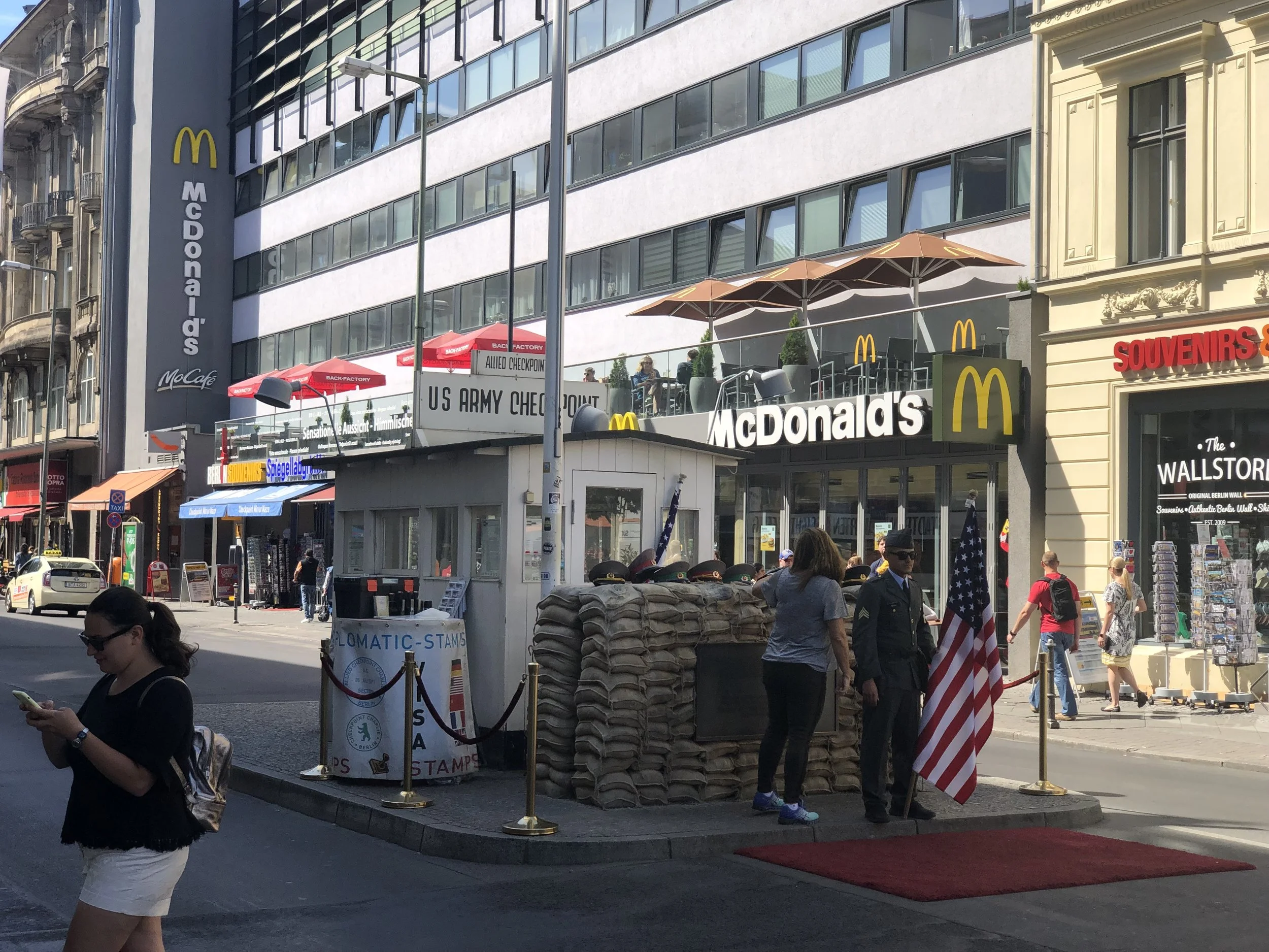 For those old enough to remember this is a photo of Checkpoint Charlie (or a recreation of it). Somewhat ironic that a McDonald’s has strategically located a restaurant nearby.
