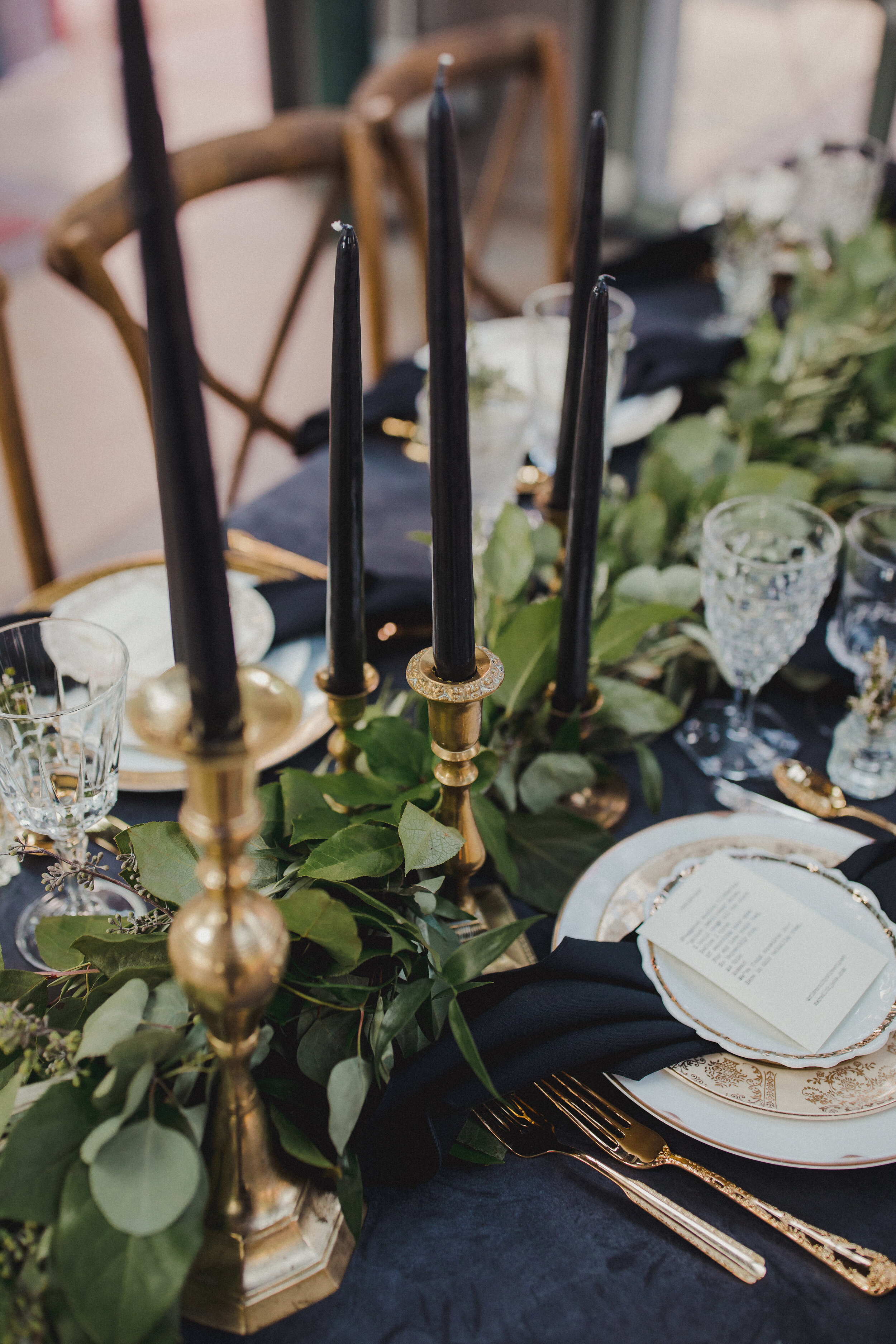 Brass candlesticks with black candles from The Copper Quail