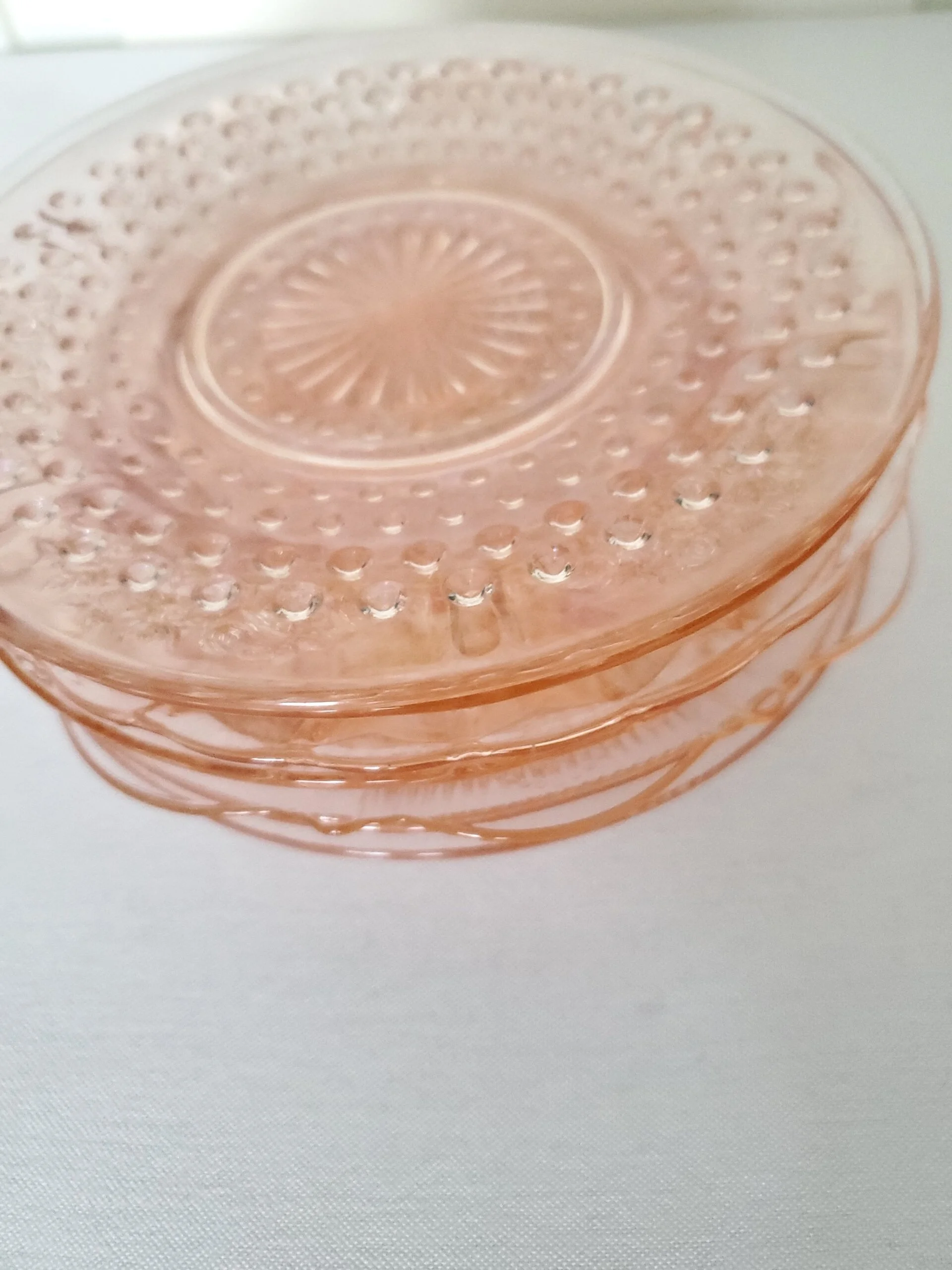 Pink glass plates from The Copper Quail