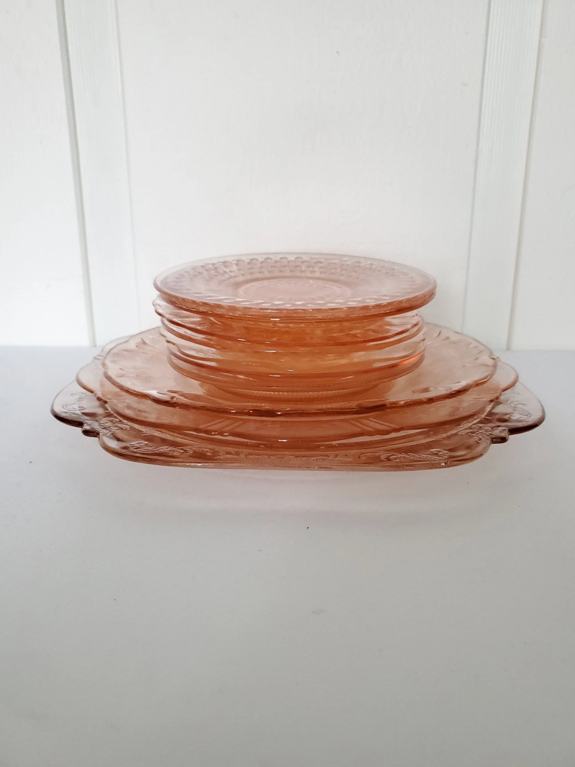 Pink glass plates from The Copper Quail
