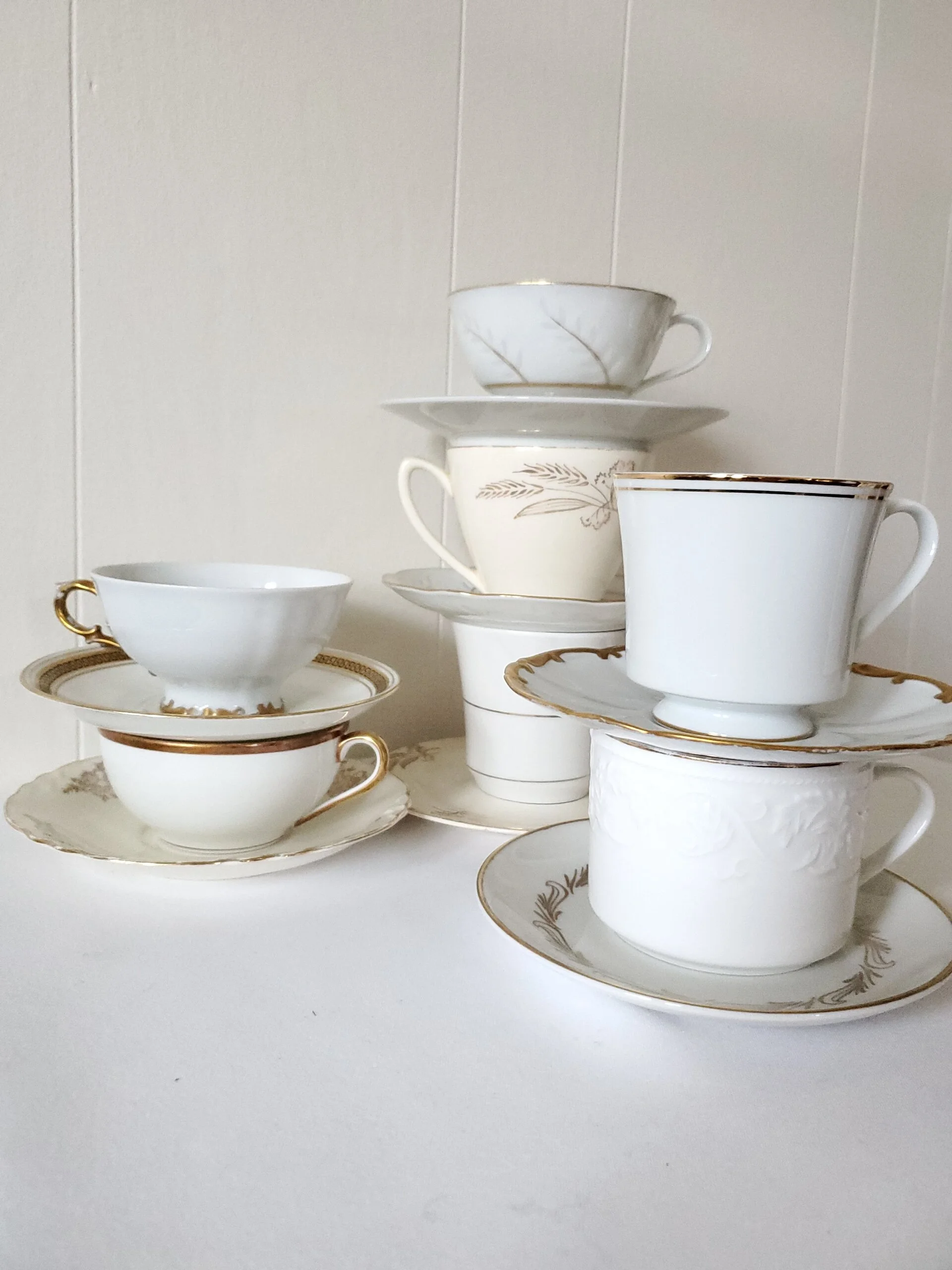 cream and gold teacups
