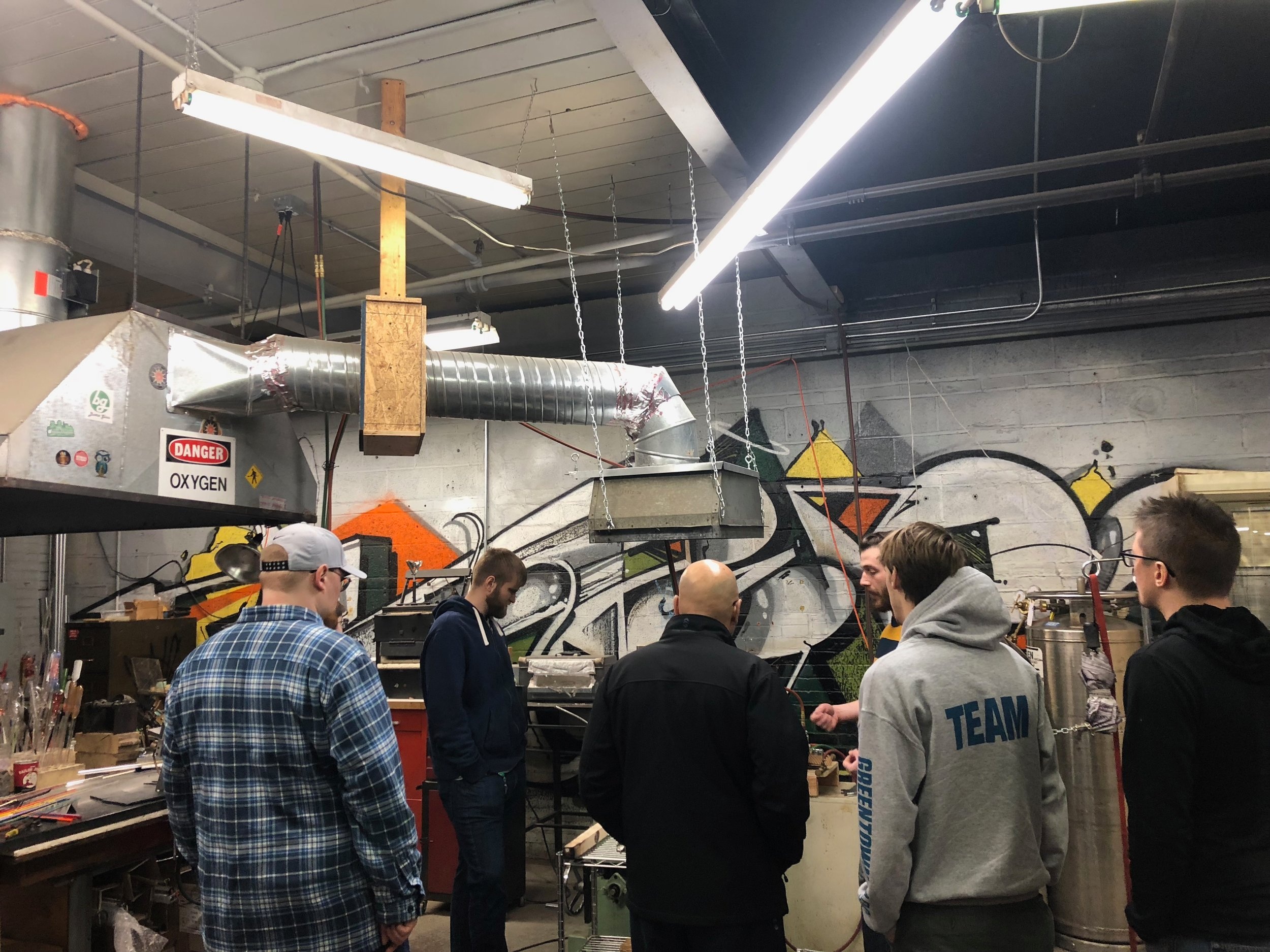 Mike Stone of Cofab Design showing off their glass blowing studio