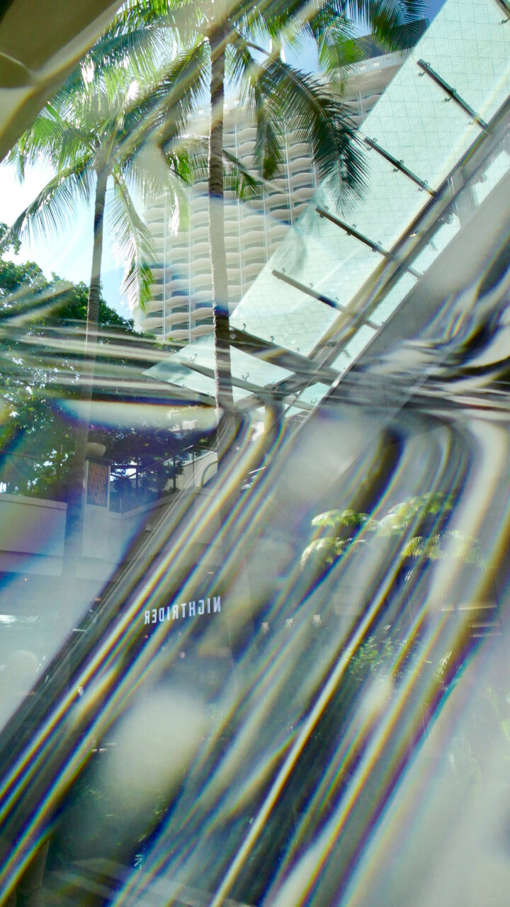 Store window reflection at the International Market Place