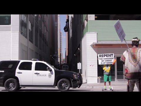 Man drives off parking garage and car hangs to safety wire- Austin Texas September 9th 2016
