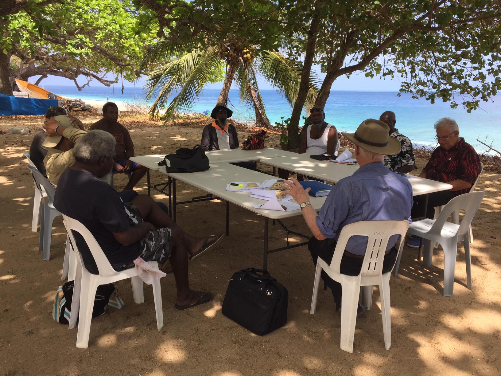 The most wonderful board room in the world! Lindsay McDowell and Kimberley man Rodney Rivers with Elders on Mer (Murray) Island in the Torres Strait (Photo courtesy David Way)