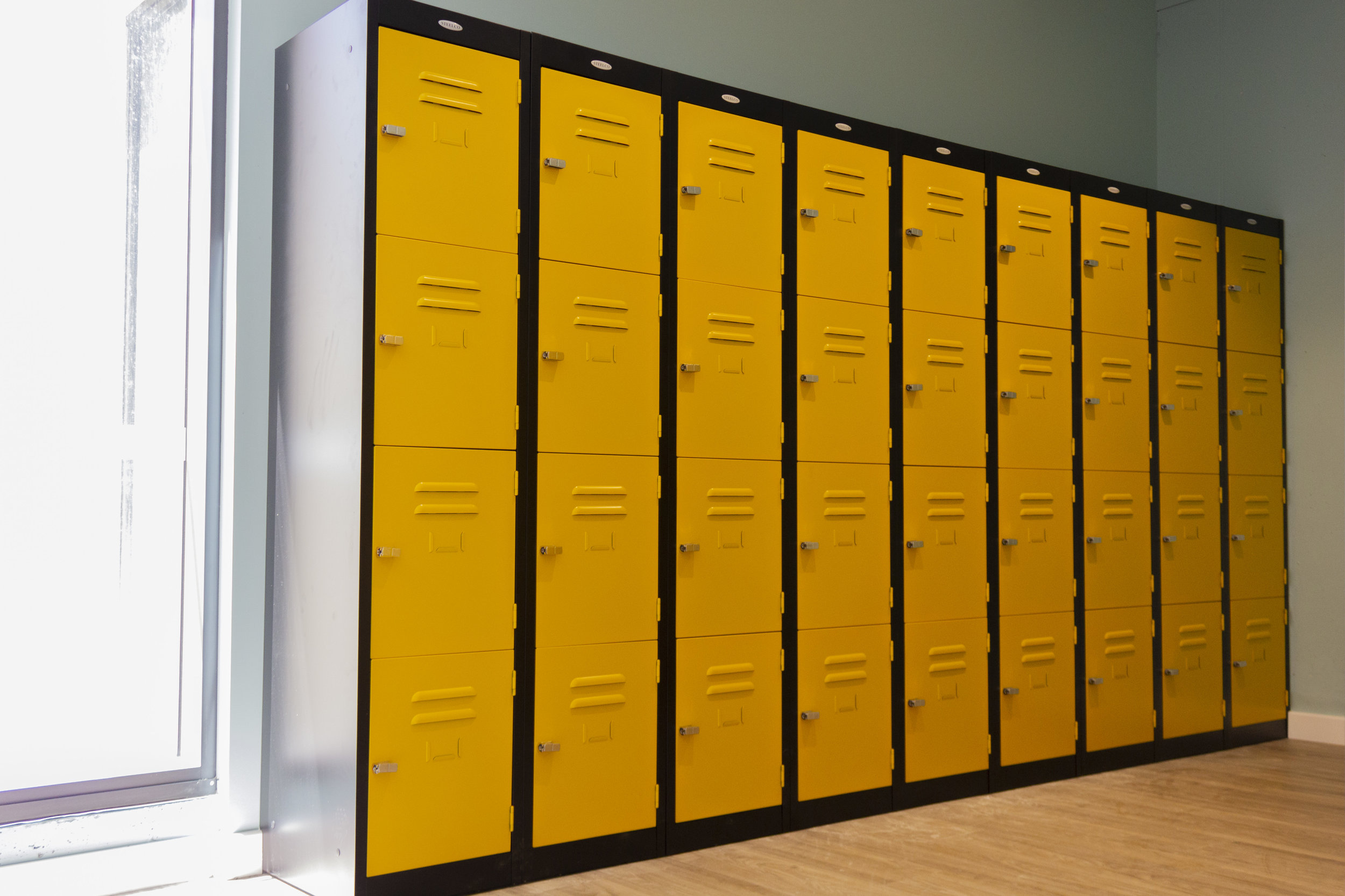 Yellow Four-Door Steel Locker with a Black Matte Finished Carcass. 