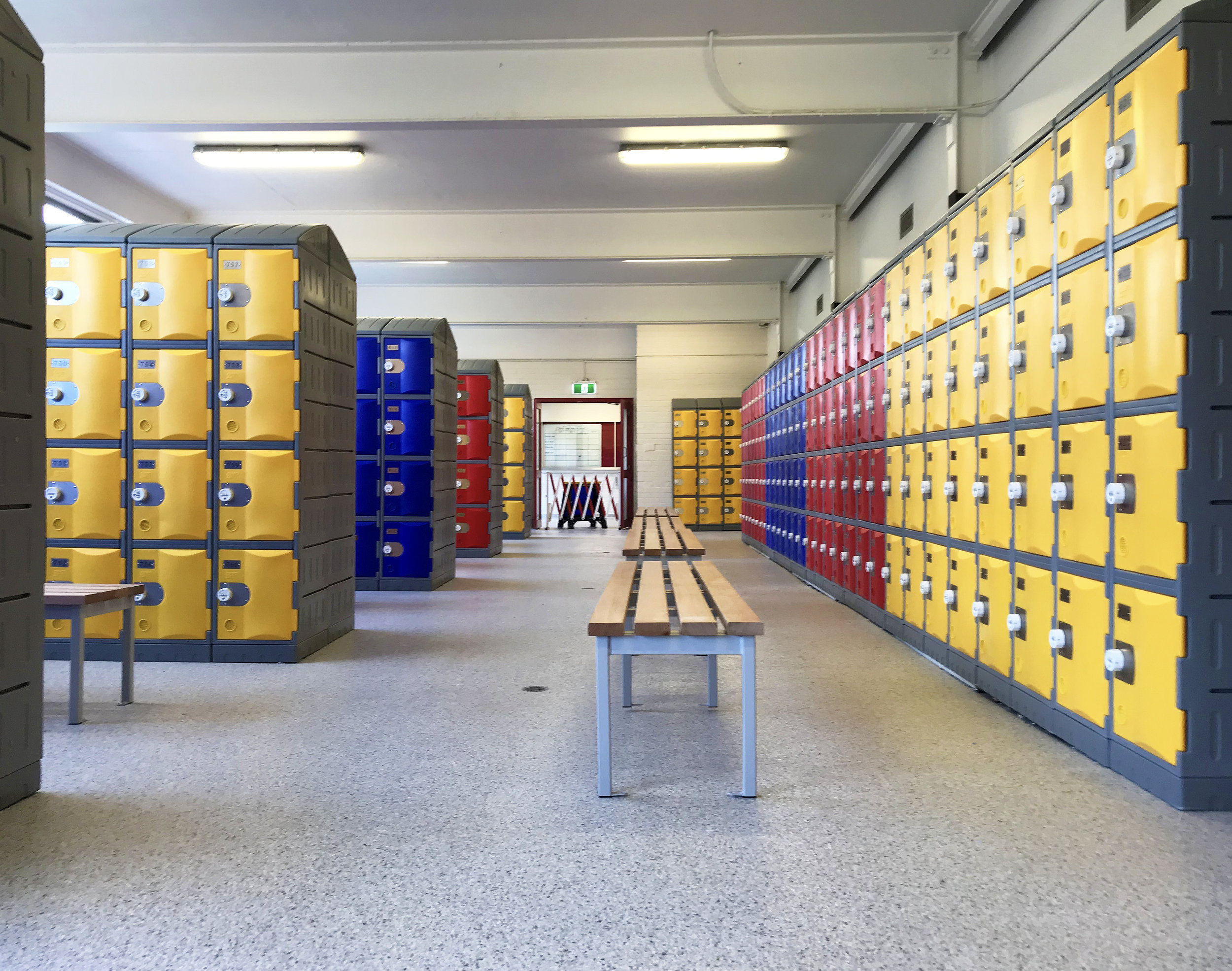 Heavy duty plastic lockers in a school change room.