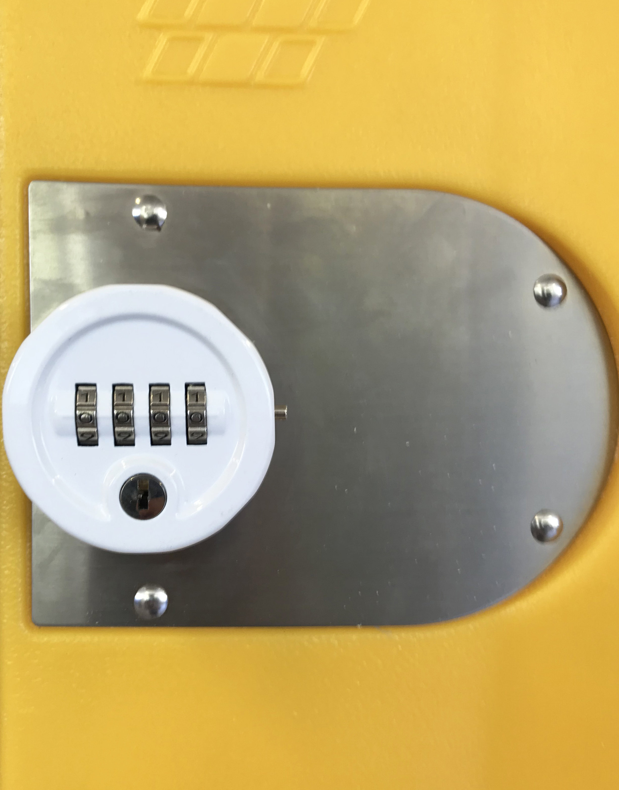 Yellow heavy duty plastic locker with round combination lock. 