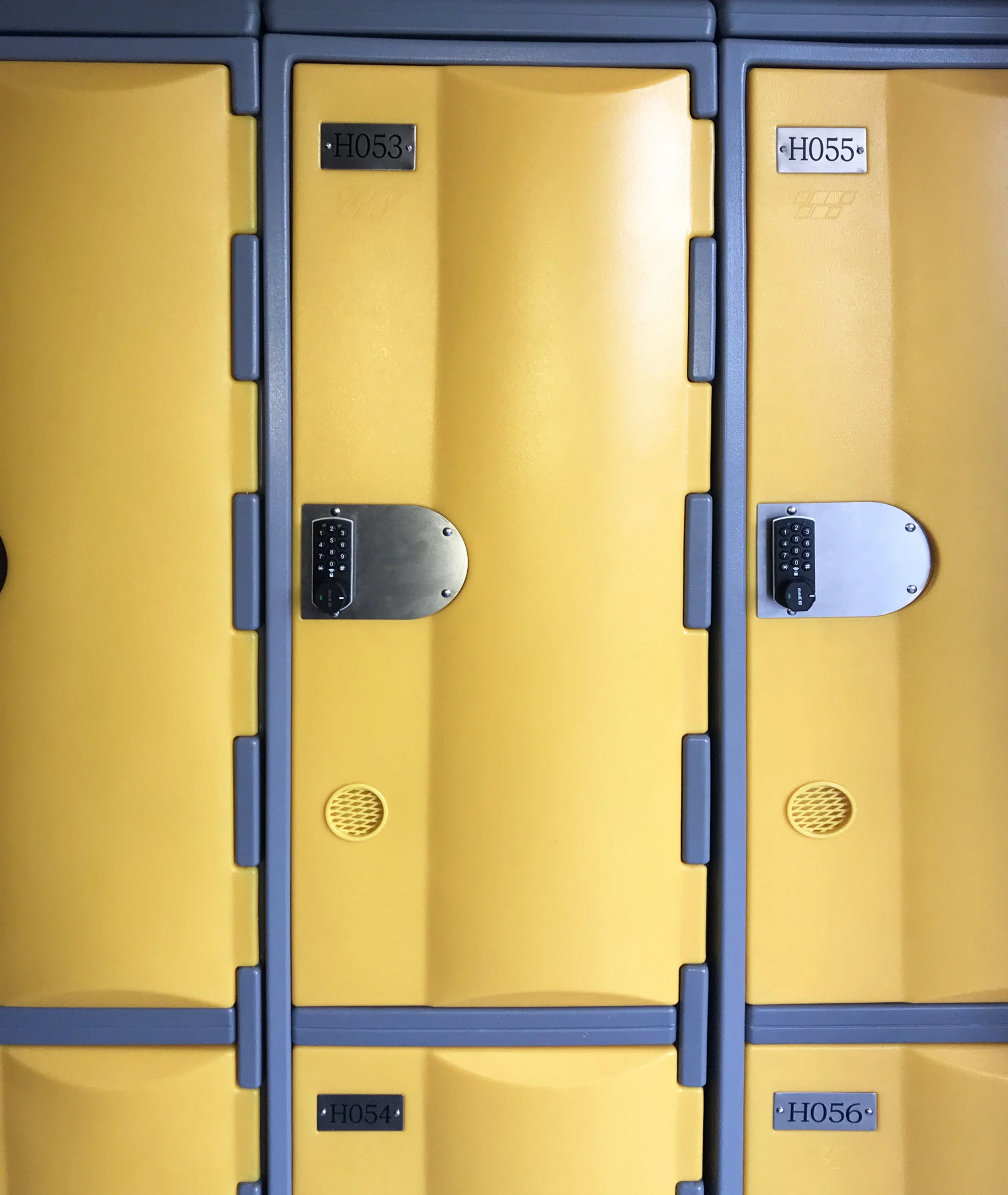 Two door yellow heavy duty plastic lockers with round combination locks