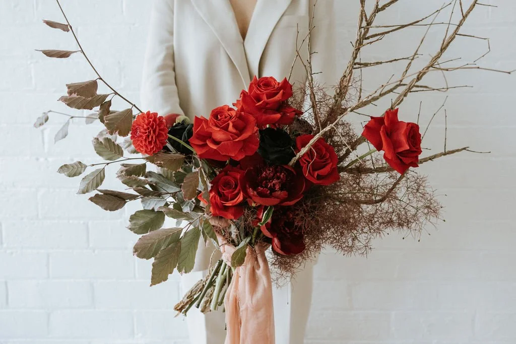Lush red roses with soft green foliage