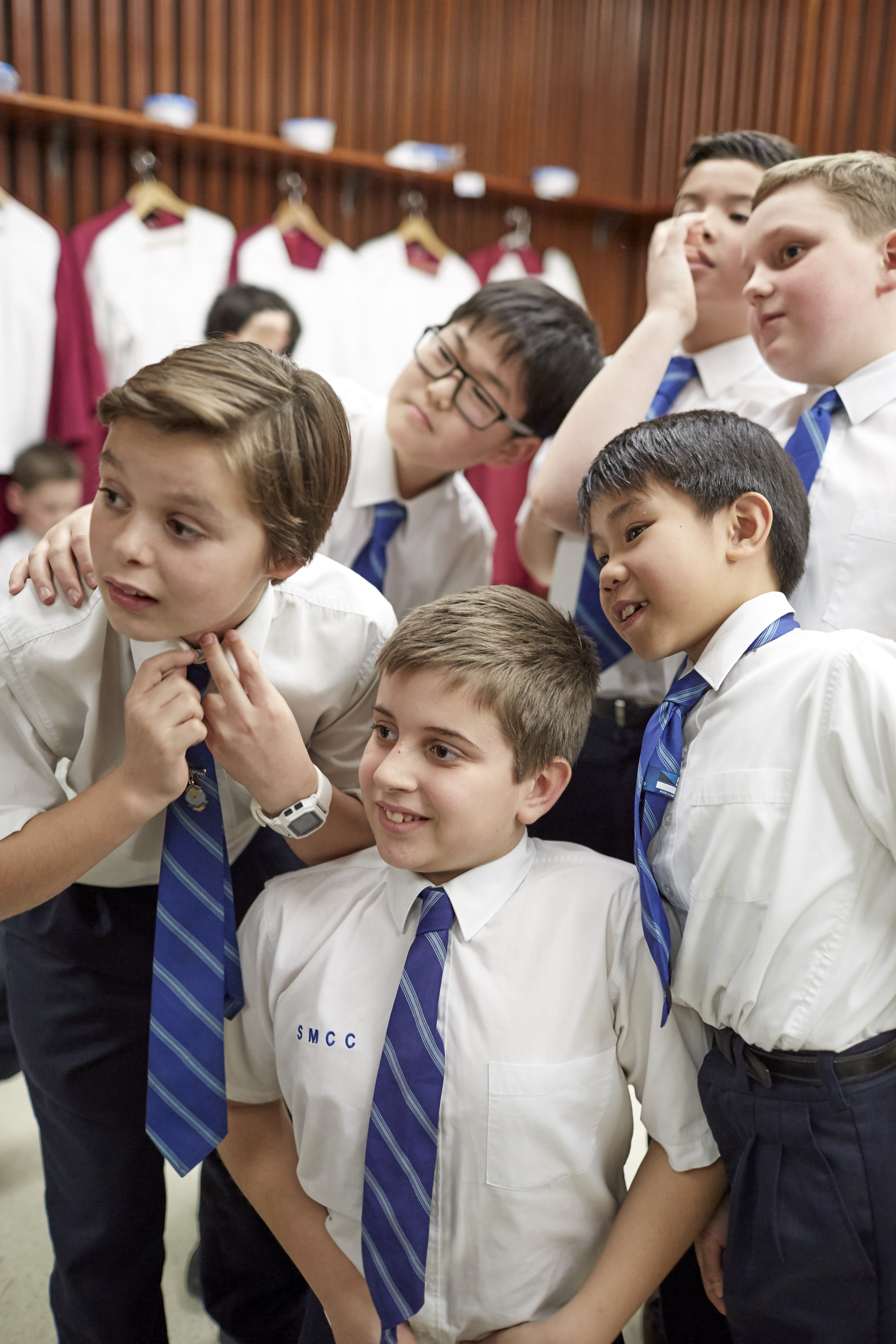 Choristers of Saint Mary’s Cathedral Choir prepare to put on their robes