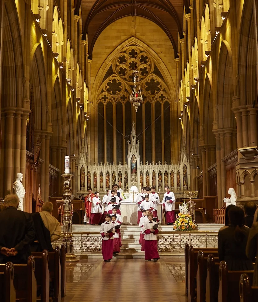 Members of Saint Mary’s Cathedral choir process out at the end of Mass.