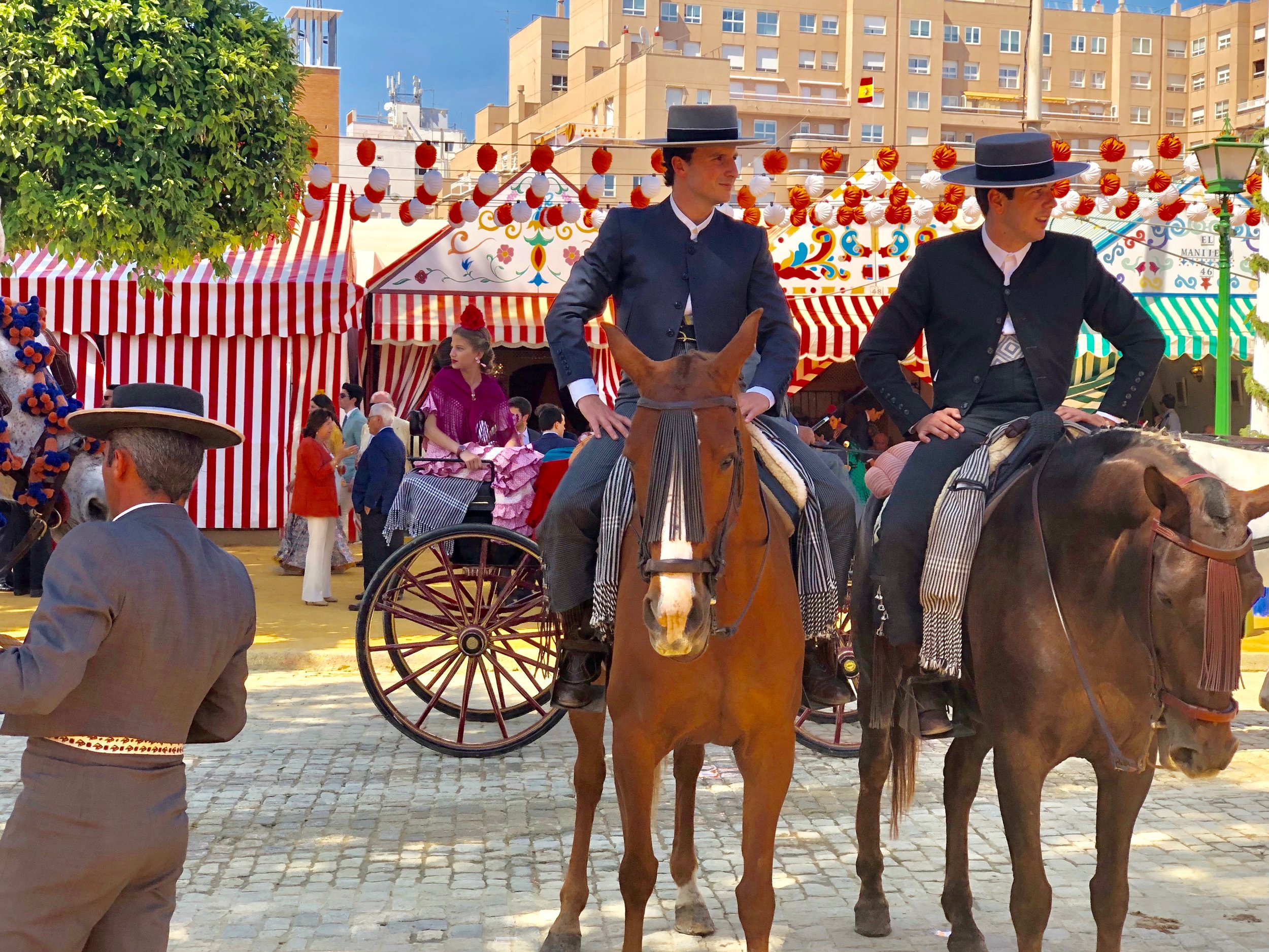 And the men who ride around in horses get to wear the sharp looking Cordobés hats and suits.