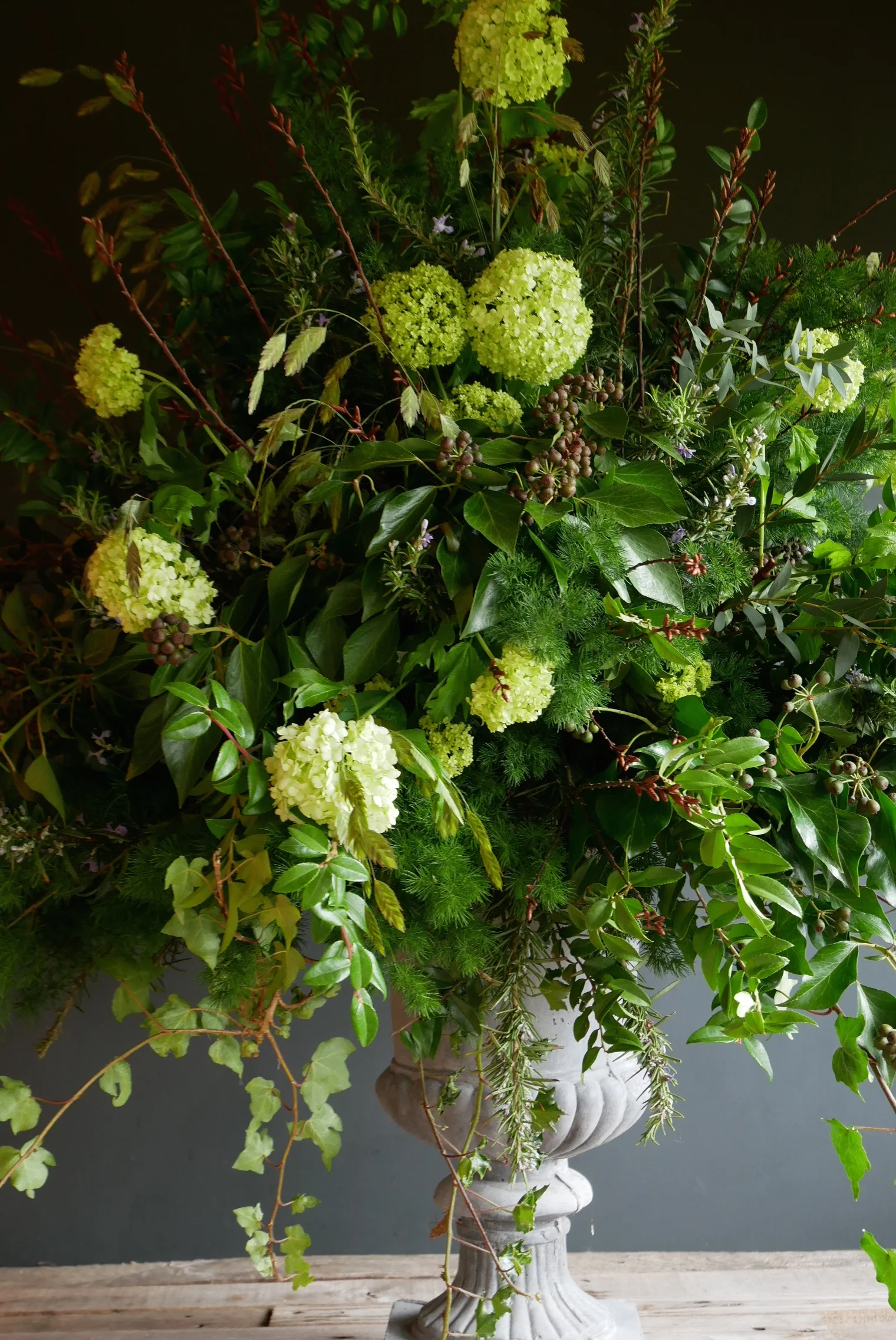 Large urn piece full of foliage, herbs and viburnum