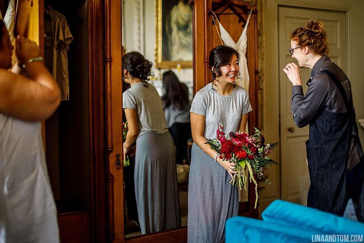 Delivering a wedding bouquet full of peonies, roses and stock at Aynhoe Park