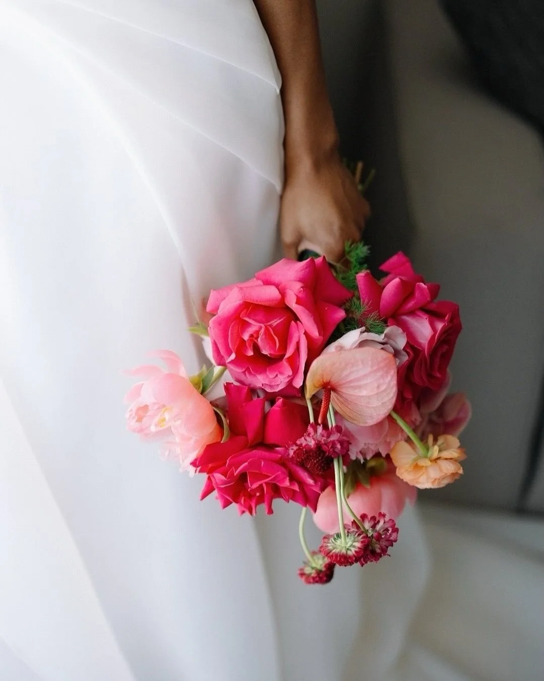 It is always a complete treat when our lovely couples embrace colour. O&amp;A&rsquo;s clashing tones of pink, coral and lilacs went beautifully with dark table linens and sophisticated table lamps. A great example of when flowers and styling come tog