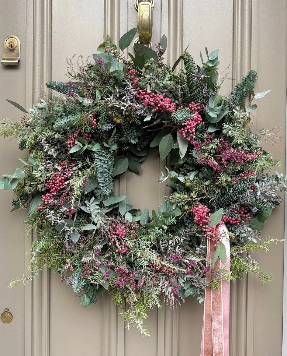 Our &lsquo;Midwinter&rsquo; wreath is full of scented, textured foliage in tones of green and grey. It is decorated with pink dried flowers, berries, pink peppercorns and finished with satin and velvet ribbons.

Our Midwinter wreath is available in t