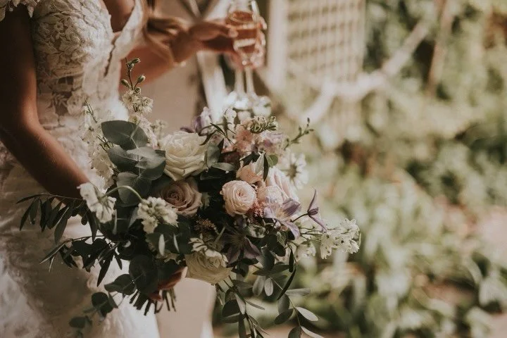 When we first start talking to you about your wedding flowers we usually start with your bouquet. Your bouquet usually sets the flower tone for your wedding. Whether your choose a loosely gathered bouquet full of delicate meadow flowers, a bold clash