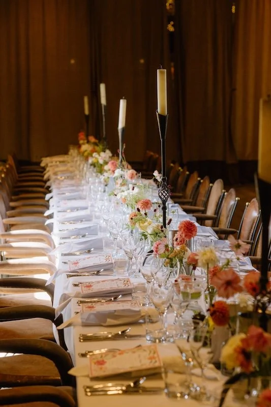 Peach, yellow and orange bud vases for wedding reception