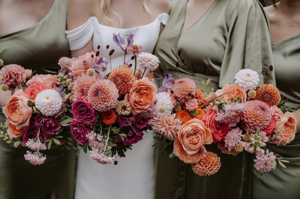 Colourful bridal bouquet full of dahlias and garden roses