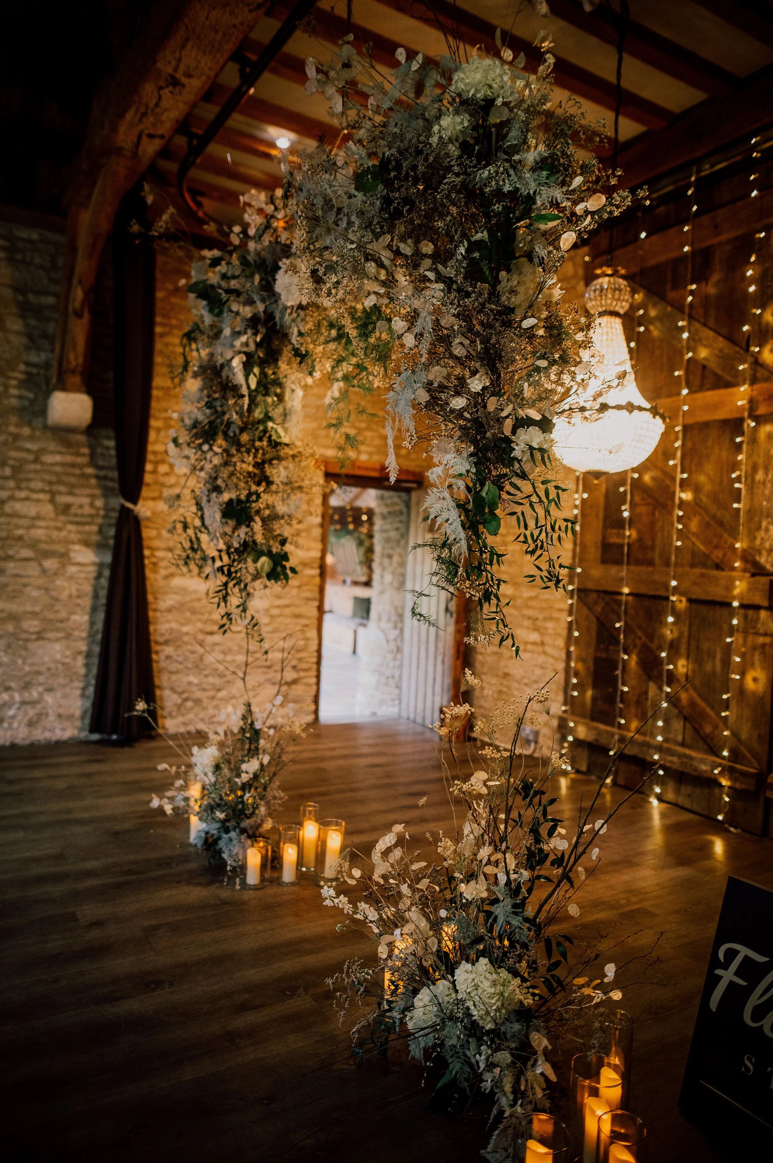 Winter flower arch with chandelier and flower meadows