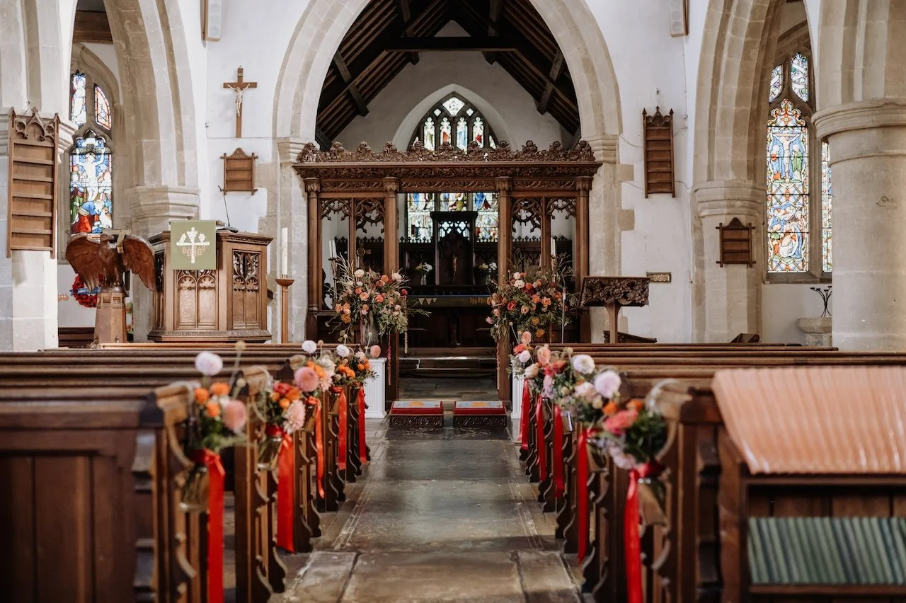 Aisle flowers and large flower arrangements at St Marys church Launton