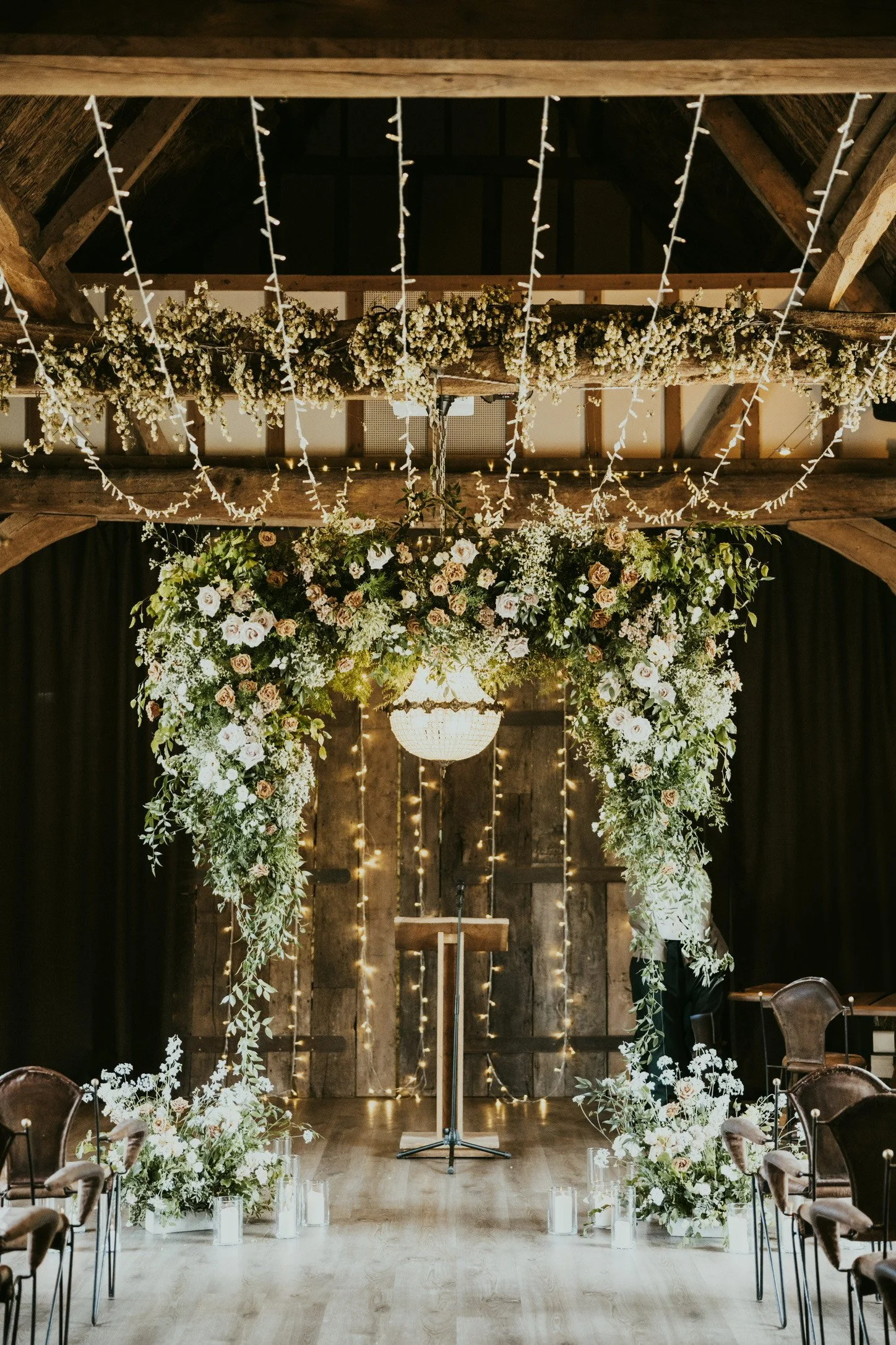 hanging flower arch full of white, peach and terracotta flowers by The Flower Story at Tythe