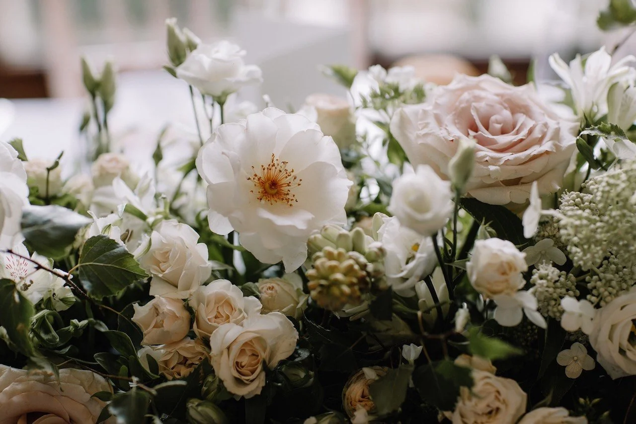garden style top table flowers with roses by The Flower Story