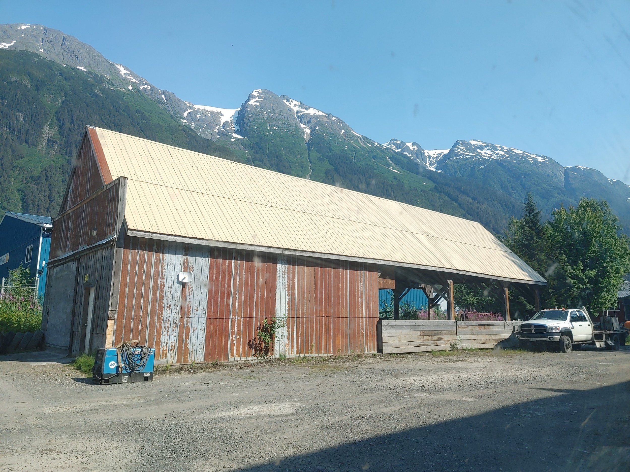  Back at Dwayne’s workshop, waiting for his to cruise by after some work errands.  He suggested I go to camp at Lake Clements, where it would be a little cooler and I could take a dip. Apparently the day use sites in Canada are friendly to overnighti