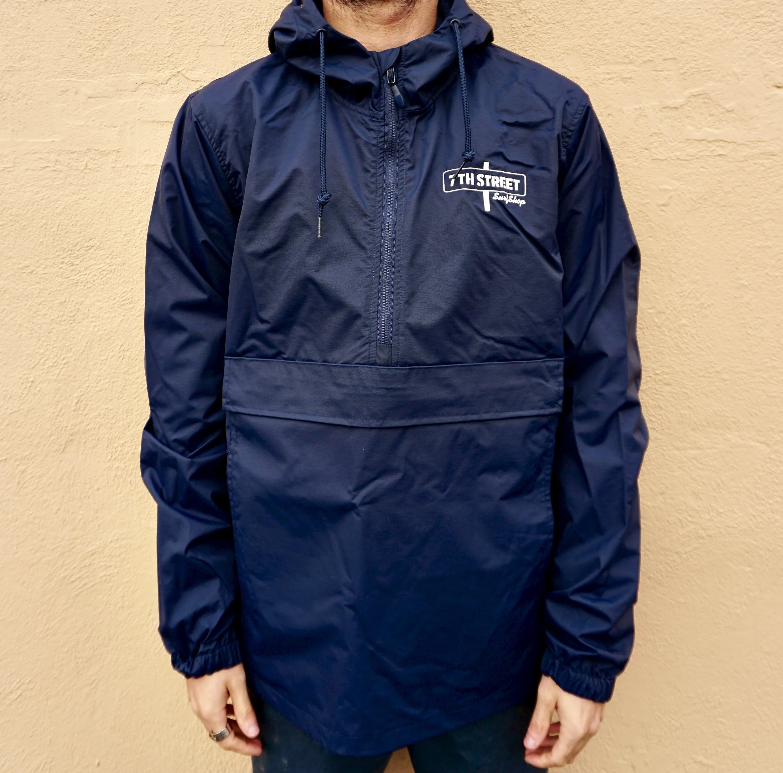 navy blue pullover windbreaker