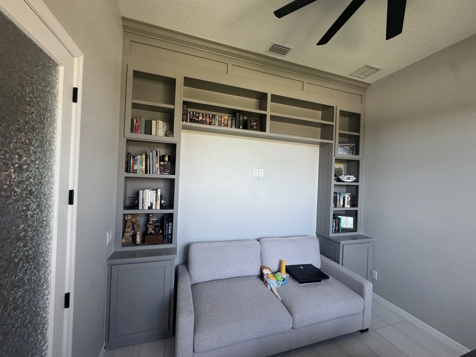 Built-in cabinets around a sofa