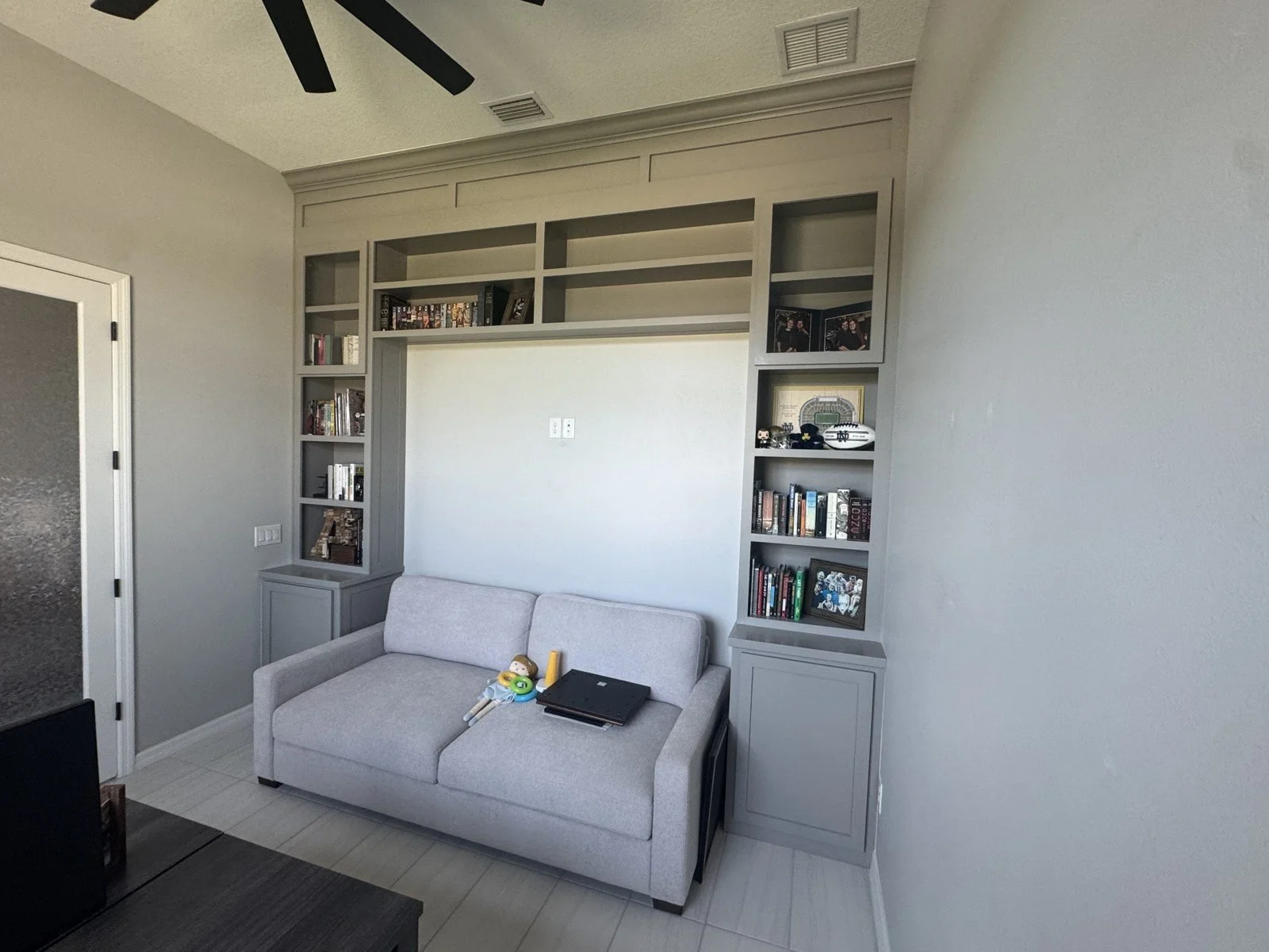 Built-in cabinets around a sofa