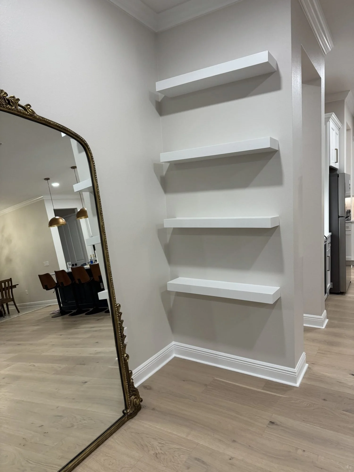 Floating shelves in a hallway nook