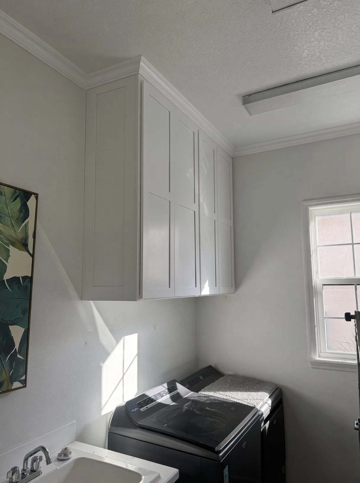 Laundry room upper cabinets with crown