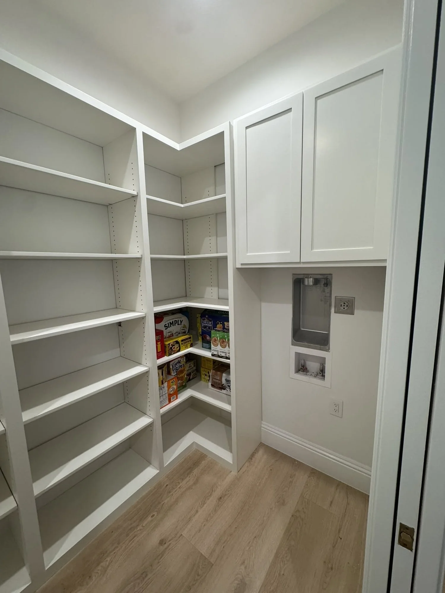 Walk-in pantry shelving with upper cabinets